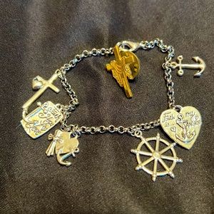 Silver tone religious charm bracelet and goldtone draped cross pin